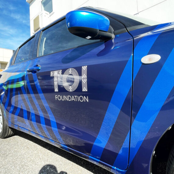 Metallic vinyl graphics on compact vehicle